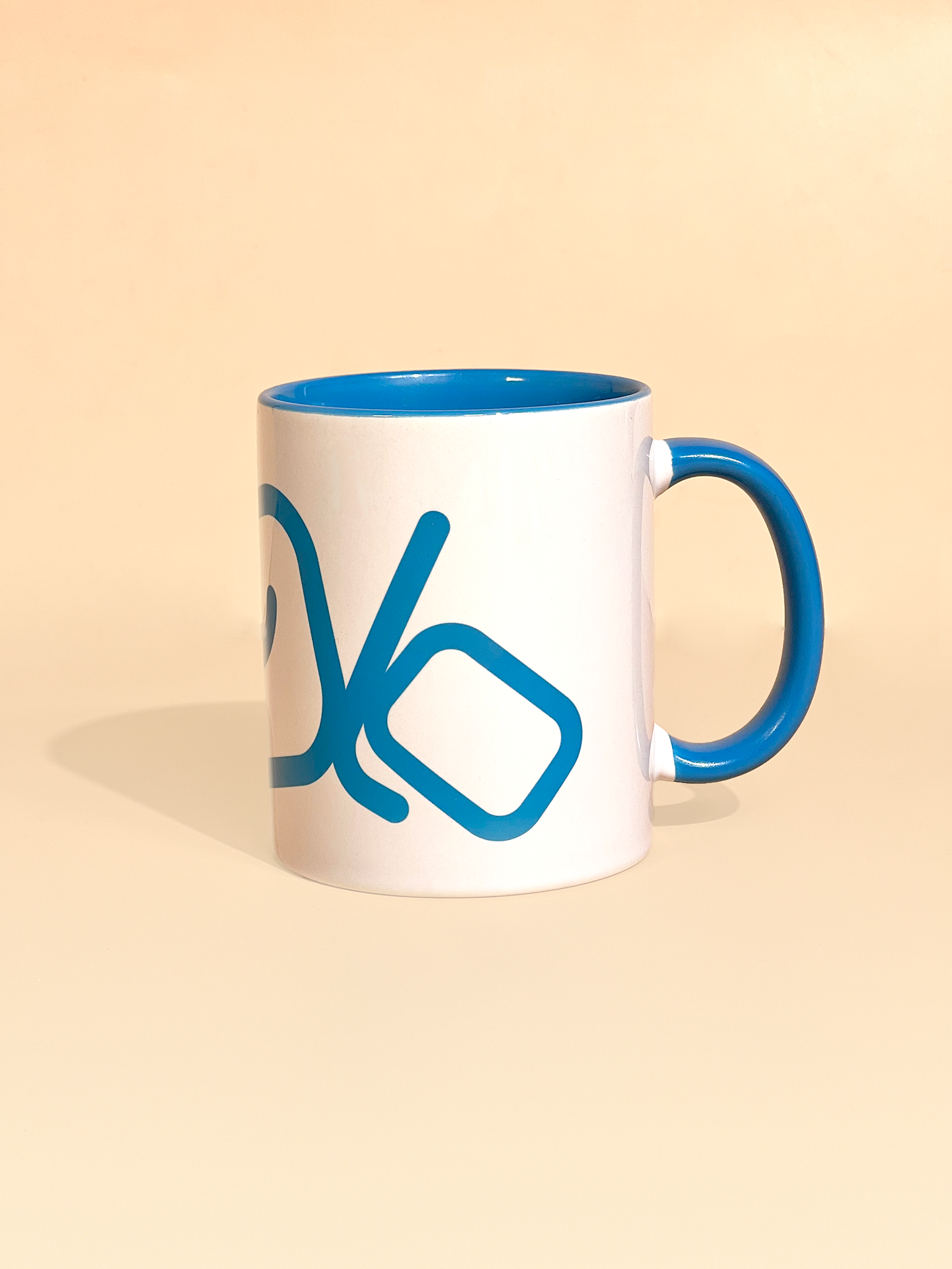 Stylist elegant olaben mug with blue olaben logo in white background outside and blue background inside