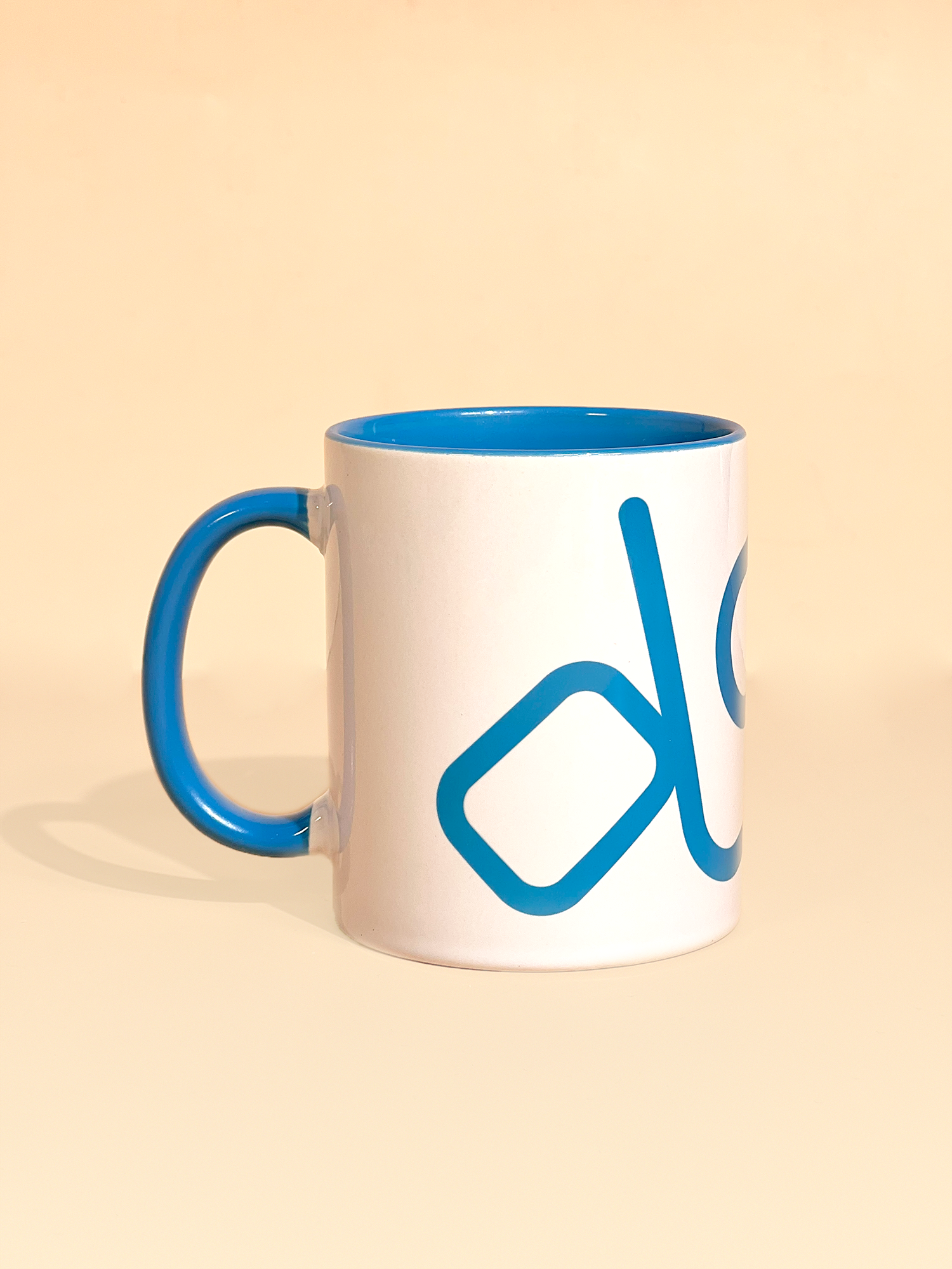 Stylist elegant olaben mug with blue olaben logo in white background outside and blue background inside