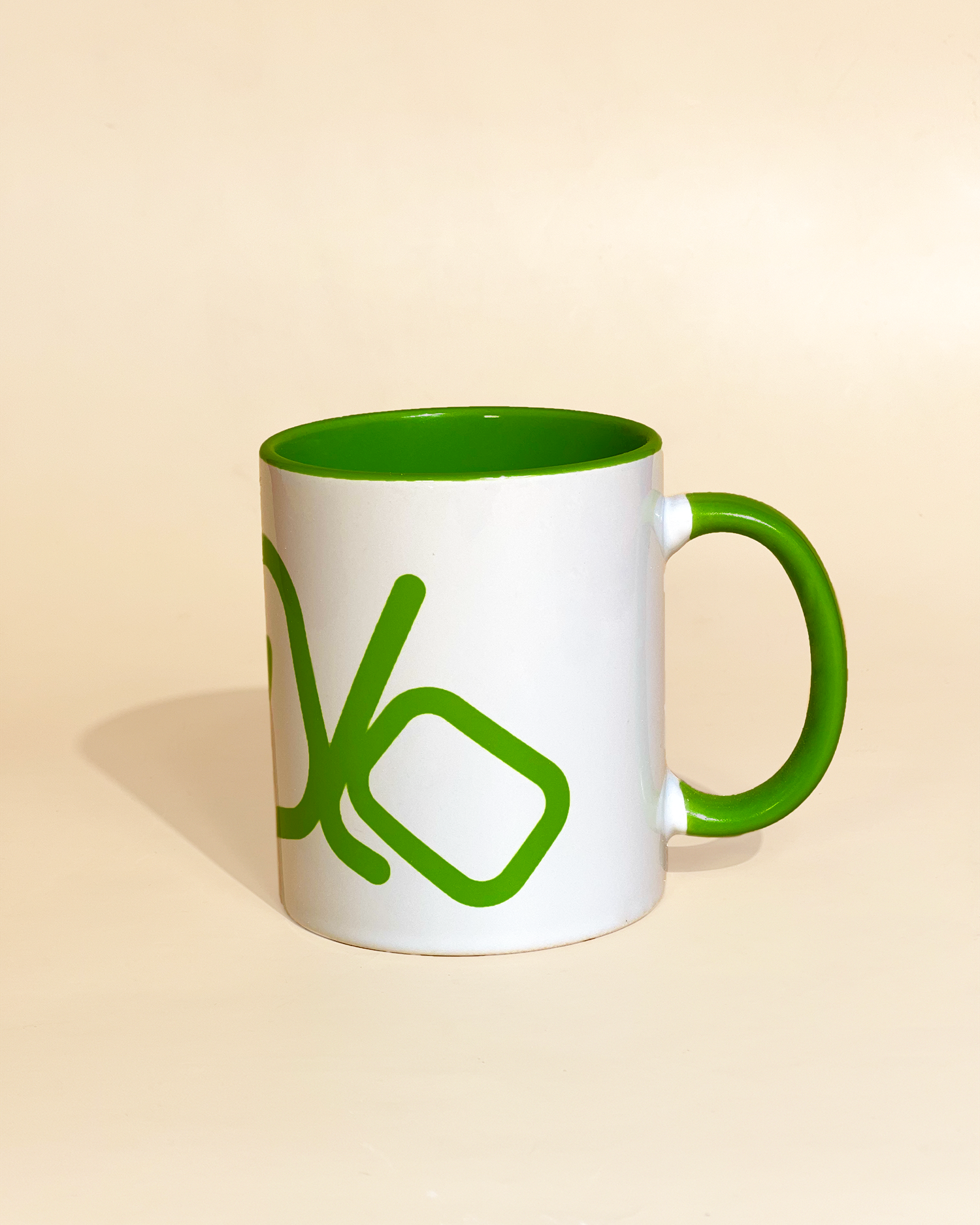 Stylist elegant olaben mug with green olaben logo in white background outside and green background inside