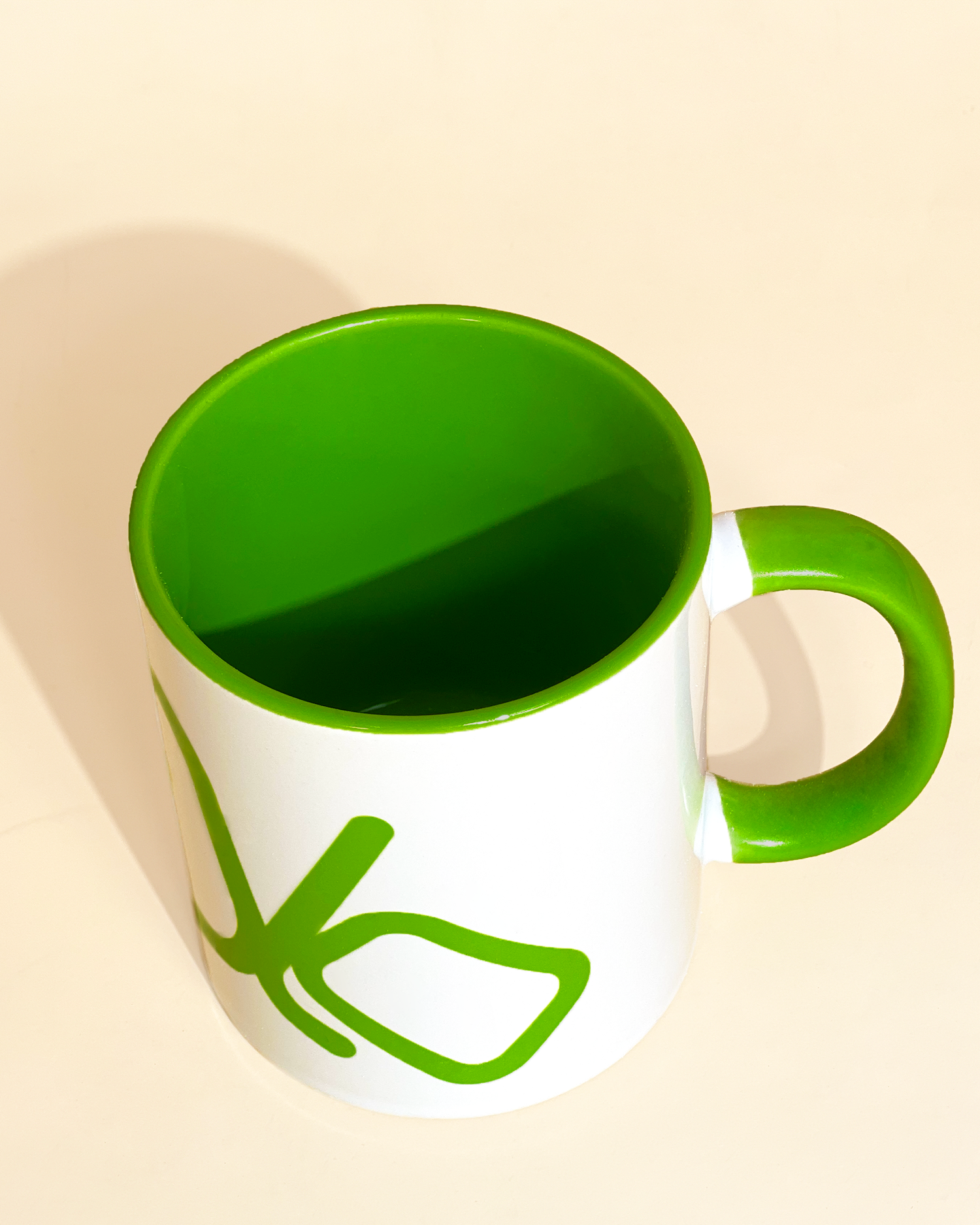 Stylist elegant olaben mug with green olaben logo in white background outside and green background inside