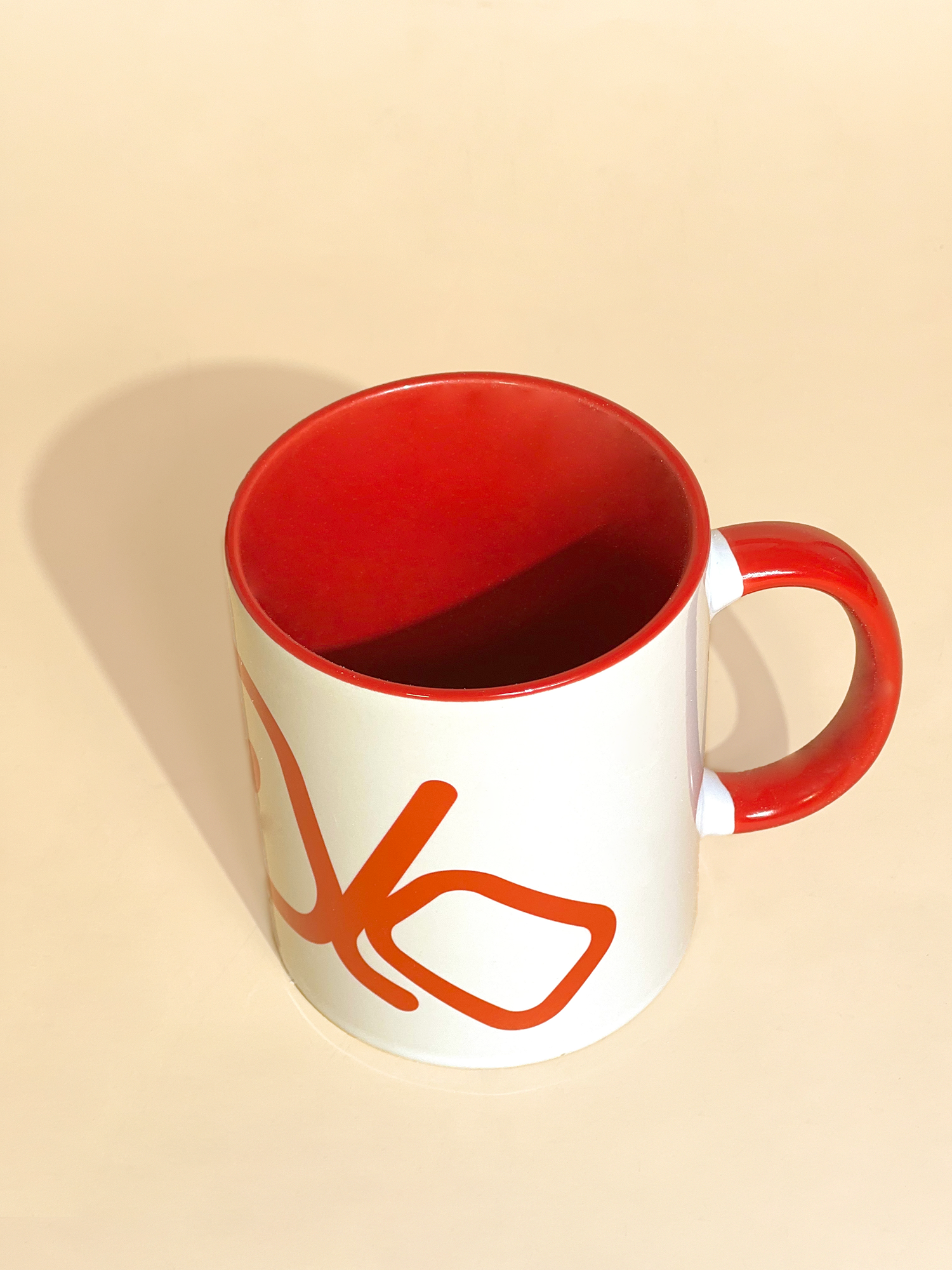 Stylist elegant olaben mug with red olaben logo in white background outside and red background inside