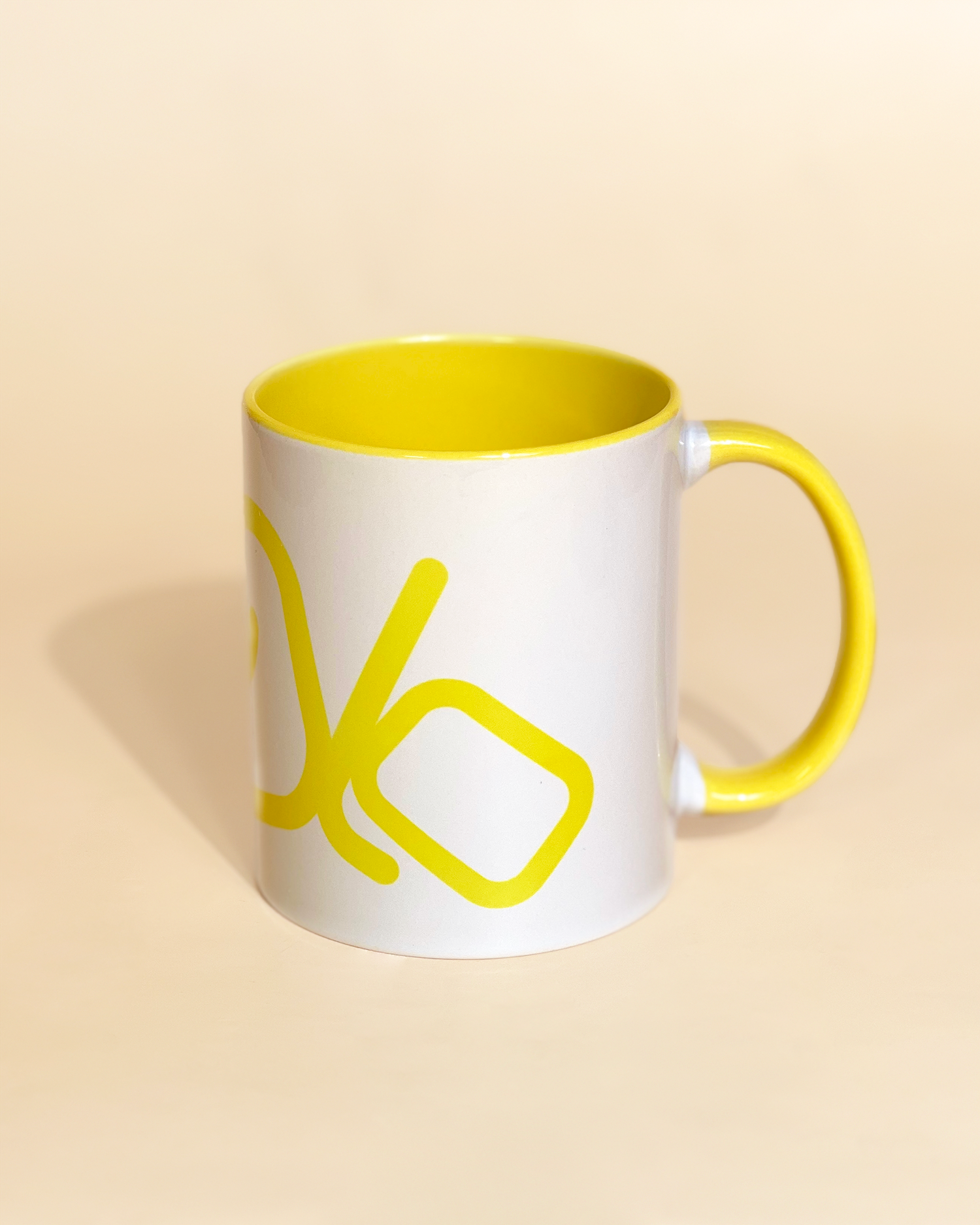 Stylist elegant olaben mug with yellow olaben logo in white background outside and yellow background inside