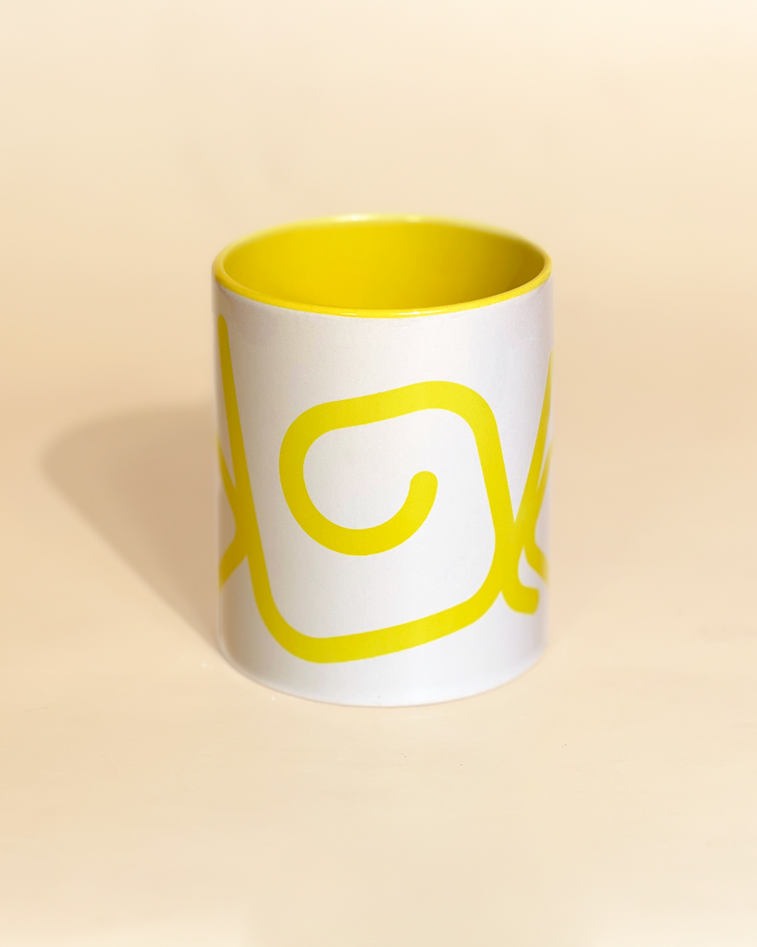 Stylist elegant olaben mug with yellow olaben logo in white background outside and yellow background inside