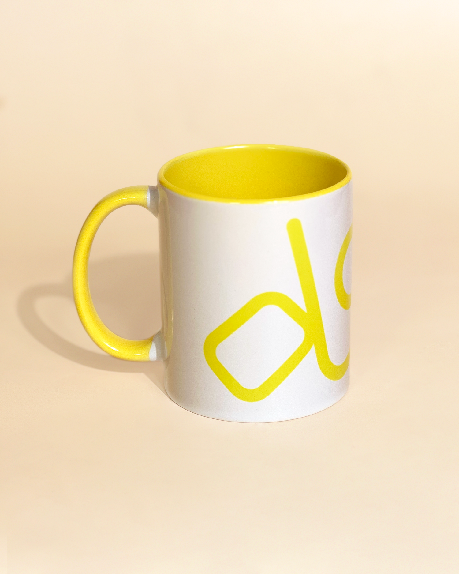 Stylist elegant olaben mug with yellow olaben logo in white background outside and yellow background inside